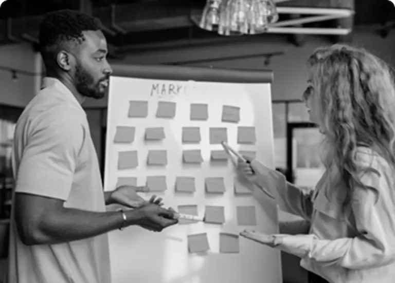 Two workers are planning some marketing strategies as a Freelance digital marketing specialist in calicut